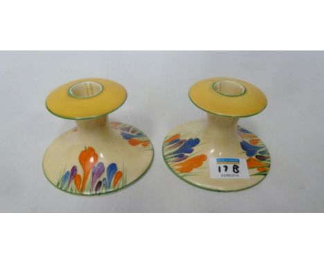 Pair of Clarice Cliff Bizzare Crocus pattern squat candle sticks, 'Wilkinson Ltd' (2) Condition Report Overall good condition