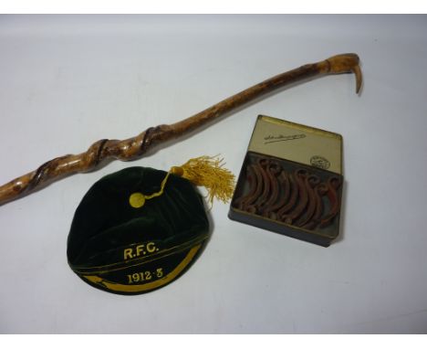 St. J RFC cap, leather gun rack clips and a twisted wooden walking stick with a Kiwi bird shaped head  Condition Report Click