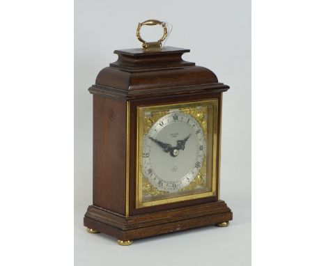 Mahogany cased clockwork mantle clock , John Walker London, Elliott, mounted by handle, stepped top brush metal face and chap