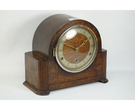 Oak finished Benting mantle clock, of arched form, silvered chapter ring, Arabic numerals, striking Westminster chimes, W 27c