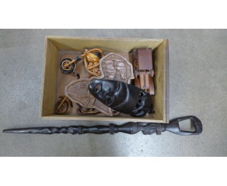 Three carved African tourist pieces and three wooden model vehicles 