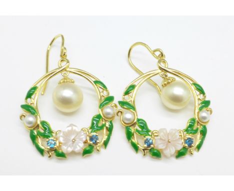 A pair of silver gilt, enamel, carved pearl and topaz earrings 