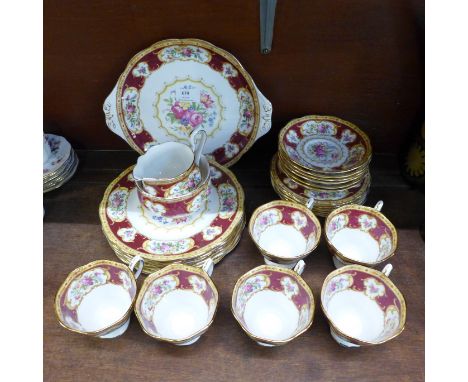 A Royal Albert Lady Hamilton tea set, six setting, with six cups, saucers, tea and side plates, cake plate, cream and sugar 