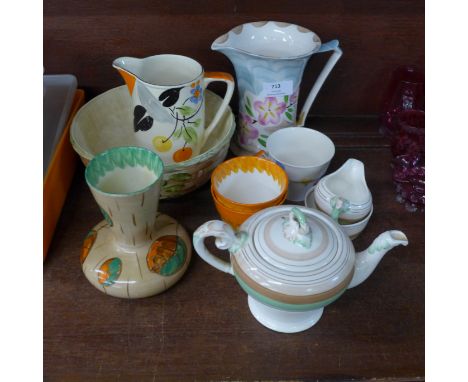 A collection of Myott Art Deco china including a tea service, two jugs and a vase 