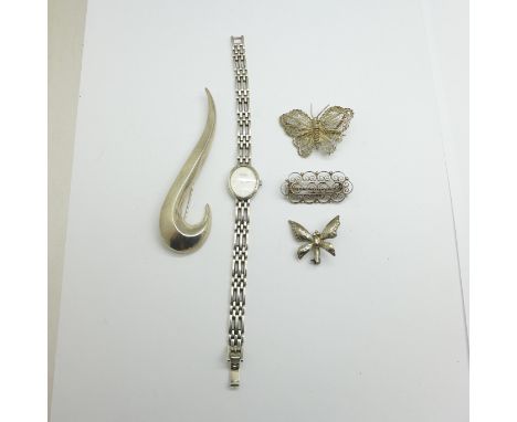 A collection of silver including a silver lady's Rotary wristwatch, two filigree brooches and two other brooches, one a butte