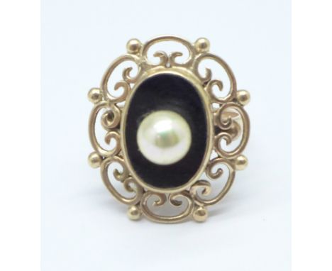 A 9ct gold, onyx and pearl set ring, 5.6g, K, (pearl added later) 