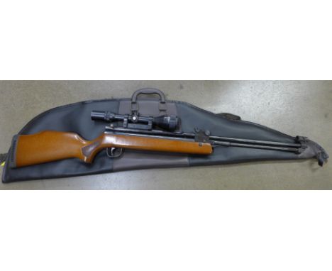 A Sterling Armaments 1980's .22 air rifle model no. HR81 and an extra sight, cased 