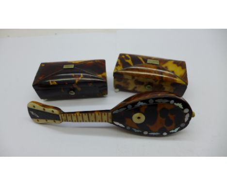 Two small caddy shaped tortoiseshell mounted boxes and a novelty miniature mandolin mounted with tortoiseshell and inlaid wit