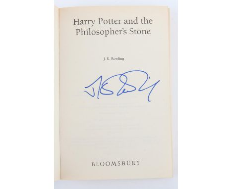 Harry Potter and the Philosopher's Stone - Paperback book signed to the inside by J K Rowling, published by Bloomsbury. With 