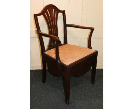 A 19th century commode chair with pierced vase splat, lift-up seat with pot and cover