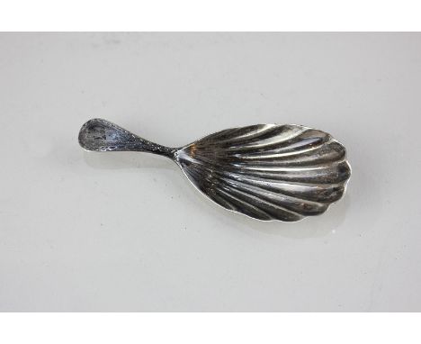 A George III silver caddy spoon with shell shape bowl and bright cut engraved handle, London 1788