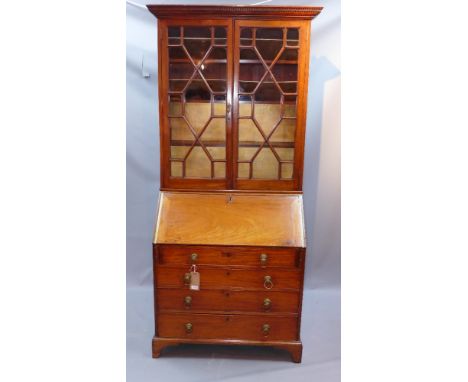 A 19th century bureau bookcase with astragal glazed doors above drop flap, four graduated drawers and raised on carved bracke