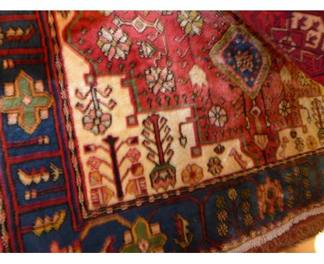 An extremely fine north west Persian Nahawand rug, 195 x 135cm central pole medallion with repeating floral motifs on a rouge