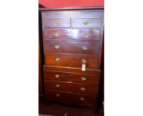 An Edwardian mahogany chest on chest with an arrangement of eight drawers raised on carved bracket feet H 202 x W 112 x D 53c
