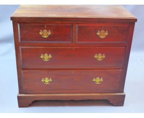 A 20th century mahogany chest of two short above two long drawers raised on carved bracket feet, H 79 x W 90 x D 43cm 