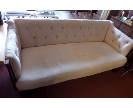 A William IV mahogany three seater sofa with cream button back upholstery, raised on scroll feet. H-80cm, W-195cm, D-78cm