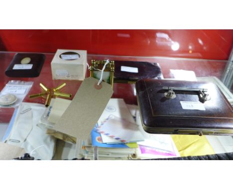 A brass miniature carriage clock together with a silver mounted wallet, a leather case, snuff box, a pocket watch and various