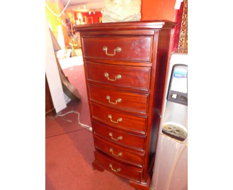 A mahogany pedestal chest of seven drawers, raised on carved bracket feet.H-121cm, W-51cm, D-38cm