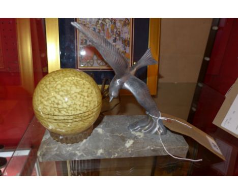 An Art Deco table lamp of a white metal bird and globe on stand. L-24cm (a/f)