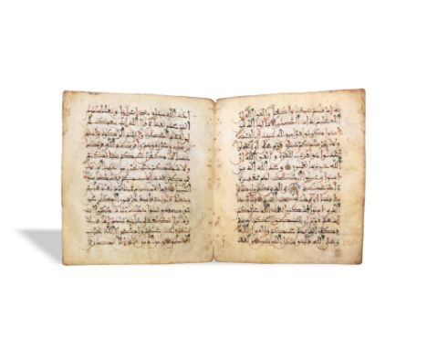 A LOOSE BIFOLIO FROM A MAGHRIBI QUR'AN North Africa or Al-Andalus, Spain, 13th - 14th centuryArabic manuscript on vellum, 13l