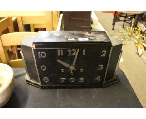An art deco three hole mantel clock 