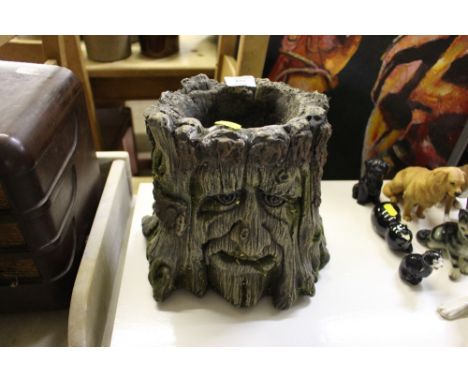 An unusual planter in the form of a tree trunk
