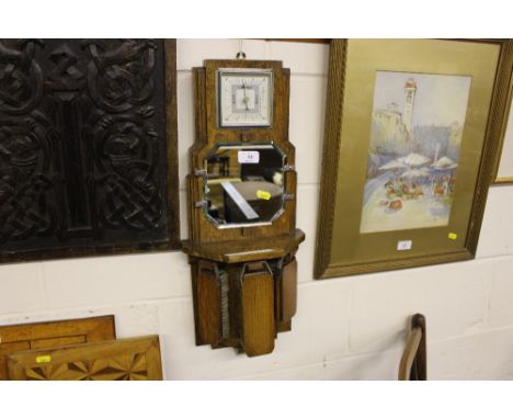 An Art Deco oak barometer and brush set