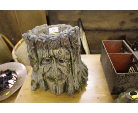 An unusual planter in the form of a tree trunk