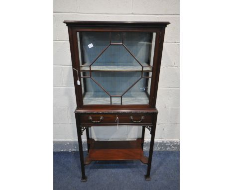 A LIBERTY OF LONDON EDWARDIAN MAHOGANY DISPLAY CABINET, the single astragal glazed door enclosing a single wooden shelf with 