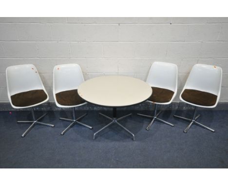 CHARLES AND RAY EAMES FOR HERMAN MILLER, a mid-century circular table, with a cream laminate top, on a four legged chrome bas