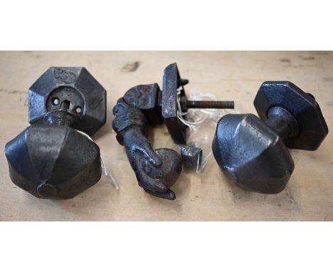 A cast iron door-knocker in the form of a hand, to/with a pair of heavy iron facetted octagonal door pulls (3)
