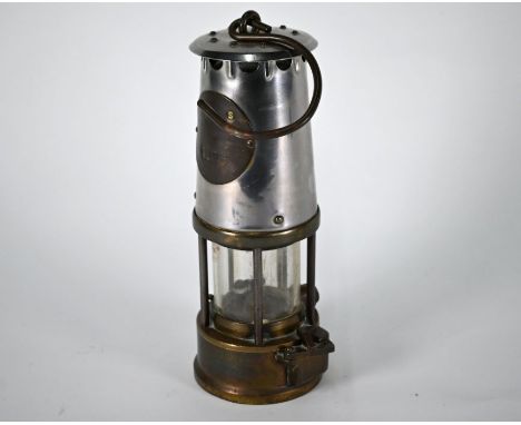 A vintage miner's lamp (maker's plate obscured)