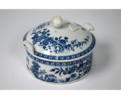 A First Period Worcester blue and white butter dish and cover with bird knop and scroll handles, printed with 'Fence' pattern