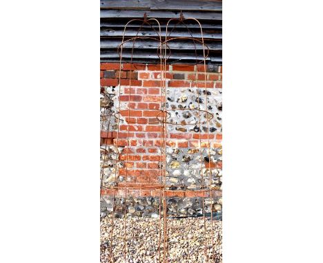 A pair of weathered steel arrow-head obelisks, approx 220 cm h x 45 cm dia 