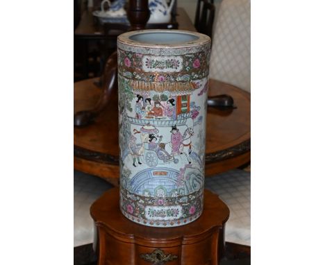 A Chinese porcelain cylindrical stick-stand, printed and painted with figures and floral designs in the famille rose manner, 