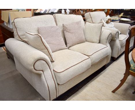 A scoll arm two seater sofa with oatmeal chenille upholstery with brown leather piping, 155 cm wide x 100 cm deep x 90 cm hig