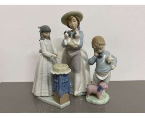 3x Nao by Lladro figures includes 1156 what an armful, 4899 cutting the cake and 1044 boy on the phone with puppets, all with