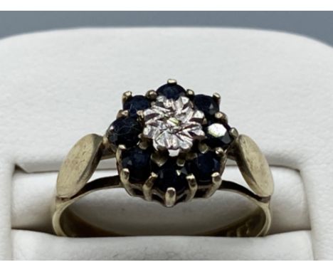 Silver gilt sapphire and diamond cluster ring size N weighing 2.7 grams