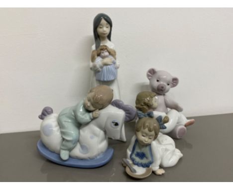 4x Nao by Lladro figures includes 1076 Not hungry, 1117 a new doll, 1477 big bear hug &amp; 1476 rock me to sleep all with or