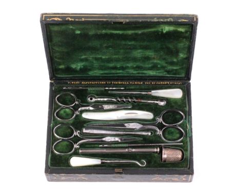 A green leather and gilt tooled sewing case with fitted tools, circa 1840, the case of rectangular form, the lid interior in 