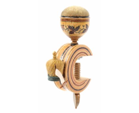 A whitewood paint and label decorated Tunbridge ware sewing clamp, the ‘C’ form frame mounted with a bee skep tape measure wi