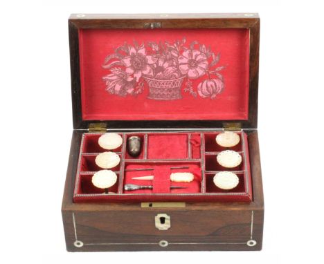 A small rosewood fitted sewing box, circa 1860, of rectangular form, the front and lid with pewter lines and mother of pearl 