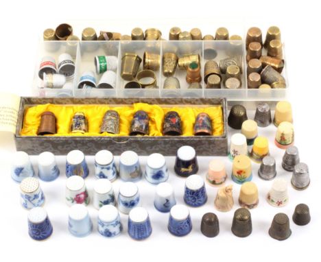 A quantity of thimbles, comprising a boxed set of six demonstrating the production of cloisonne thimbles, eighteen ceramic by