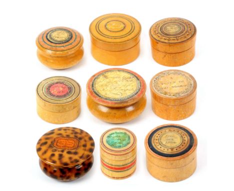 Nine whitewood label and paint decorated Tunbridge ware circular boxes, the labels comprising ‘Think on the Giver’, ‘Give Me 