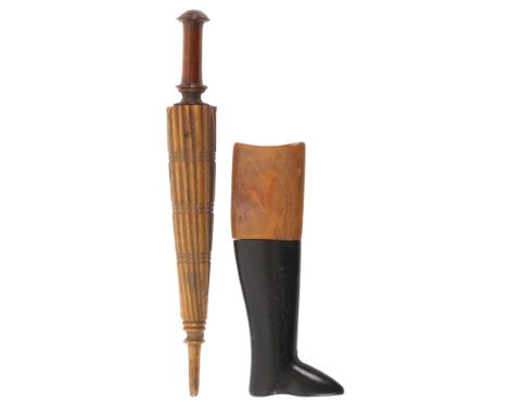 Two carved wood needle cases, one in ebony and boxwood in the form of a huntsman’s boot, 6.5cms, the other in the form of a f