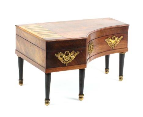 A Palais Royal musical mahogany sewing box in the form of a grand piano, circa 1830, raised on five ebony legs with gilt bras