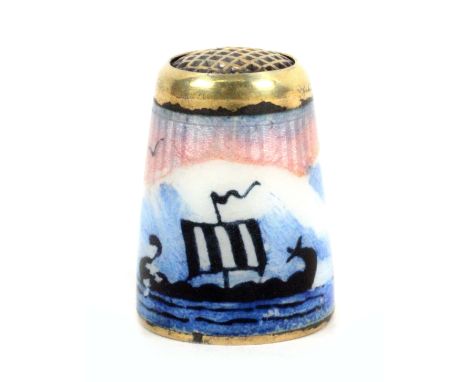 A Norwegian silver gilt and enamel waffle top thimble, depicting two Viking sailing boats at sea, internal apex marks ‘Norway