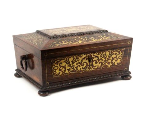 A good example of a rosewood and cut brass sewing box, circa 1820, of sarcophagol form, with quarter bobbin mouldings, rosewo