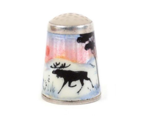 A Norwegian silver and enamel thimble with moonstone top, depicting two moose in a snowy landscape with silhouette trees and 