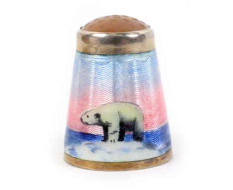 A rare Norwegian silver gilt and enamel thimble with moonstone top, depicting a polar bear on a snowy island amid the sea wit